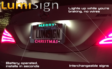 Load image into Gallery viewer, LumiSign – The Auto Illuminated License Plate Frame with Switchable Inserts | Lights Up While You Brake | No Wires, Battery Operated | Installs in Seconds (Black Frame)
