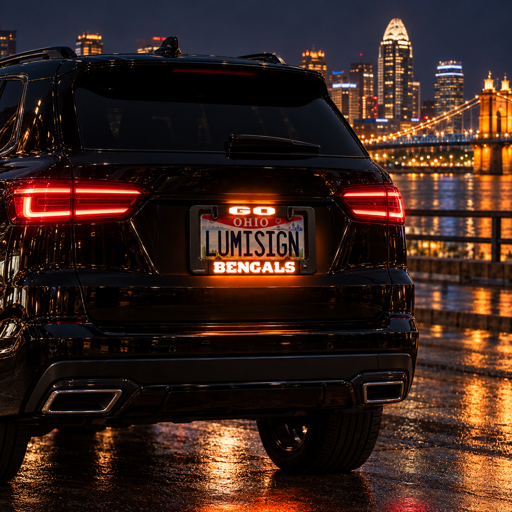 Illuminated GO Ohio Lumisign Bengals license plate frame on SUV rear, nighttime