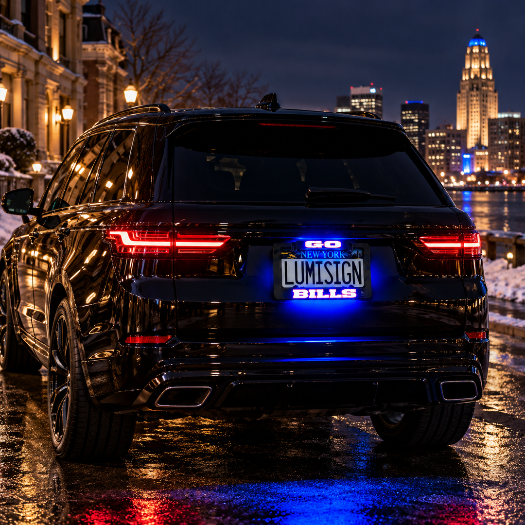 Black car license plate frame with illuminated “LUMISIGN” and “BILLS” text