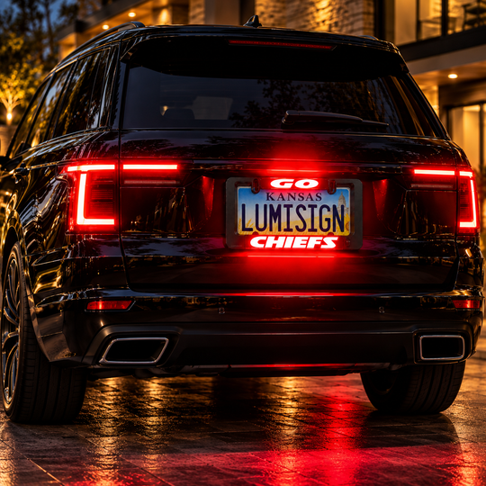 Black LED license plate frame with red CHIEFS light bar, mounted on vehicle rear