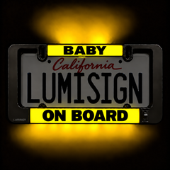 Light-up Lumisign license frame with yellow BABY ON BOARD inserts