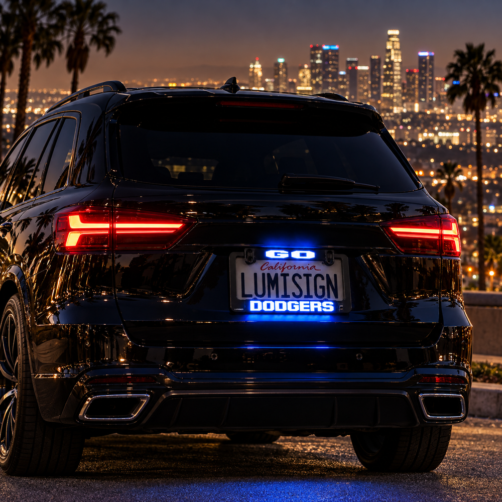 Car rear with glowing LED license plate frame reading "LUMISIGN DODGERS"