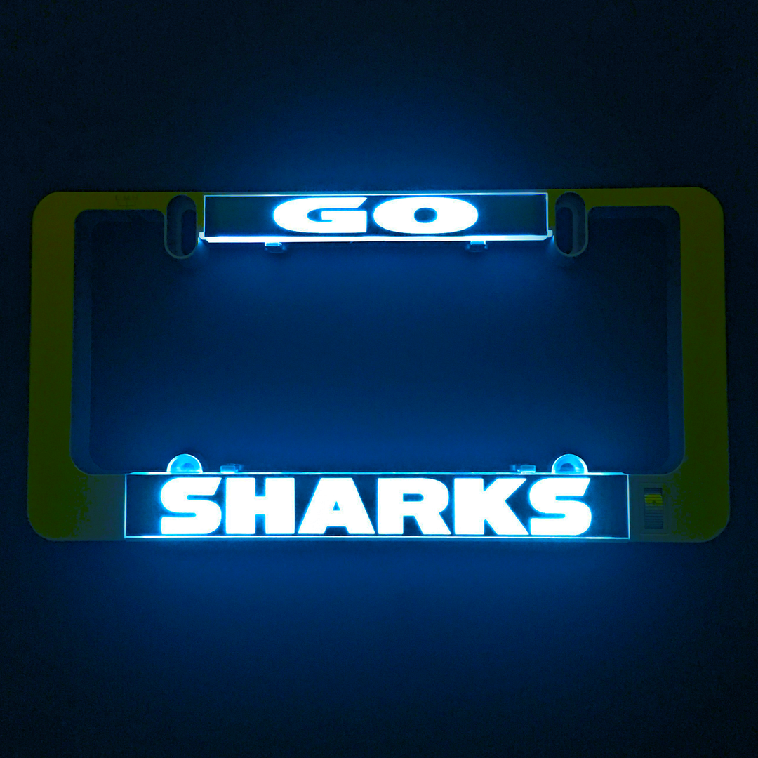Gray LumiSign illuminated license plate frame with glowing GO and SHARKS text