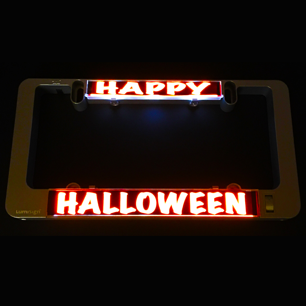 Glowing Happy Halloween light inserts on dark holder with HALLOWEEN strip