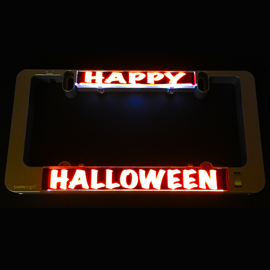 Glowing Happy Halloween light inserts on dark holder with HALLOWEEN strip