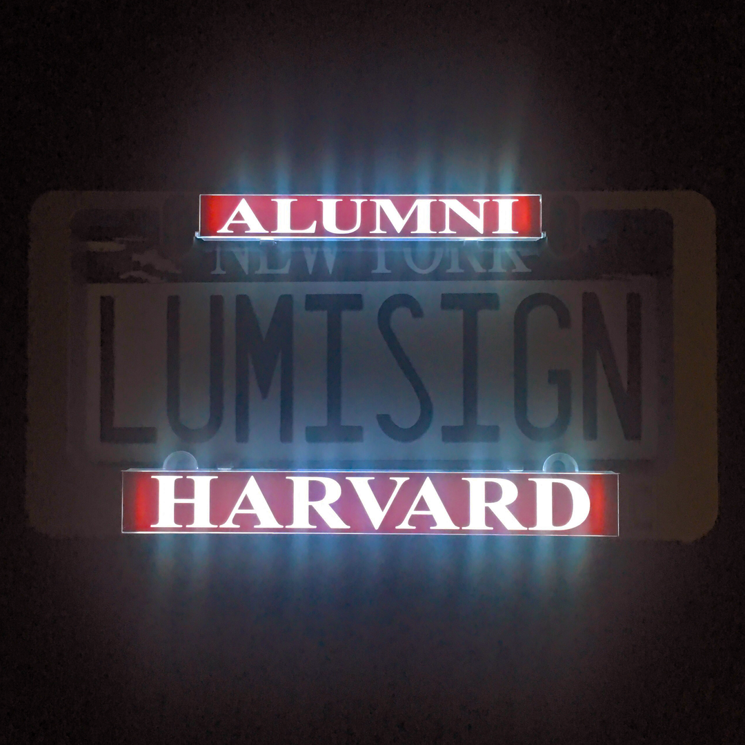 Harvard alumni inserts with illuminated “ALUMNI” and “HARVARD” logo text