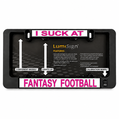 Black light-up license plate frame: 'I SUCK AT' and 'FANTASY FOOTBALL'