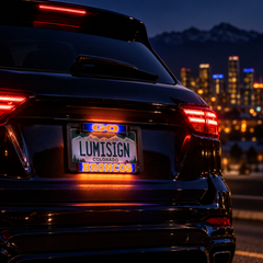 Lumisign LED license plate frame on car with glowing Go, Broncos, and state text