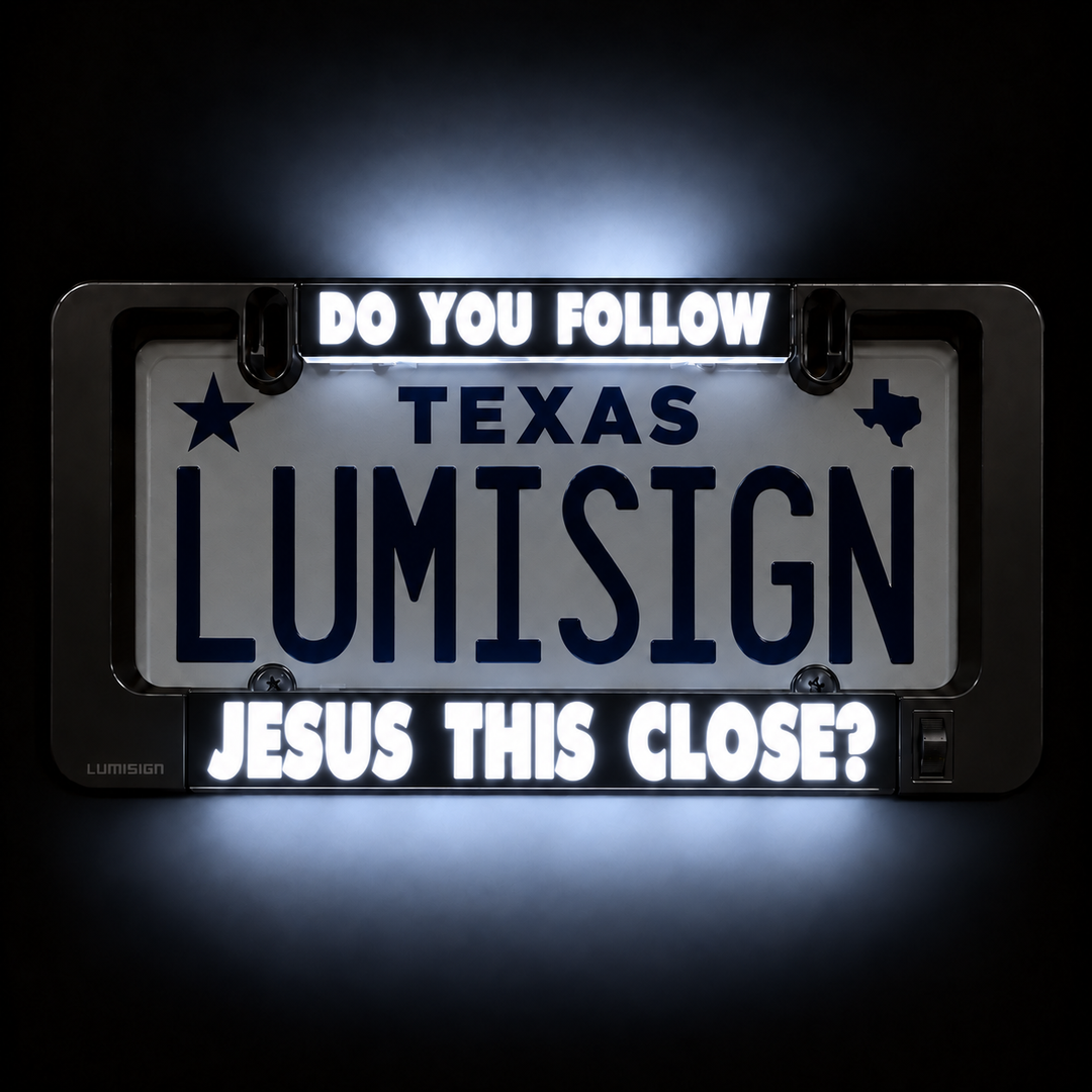 Close-up of illuminated license plate frame reading “TEXAS LUMISIGN”