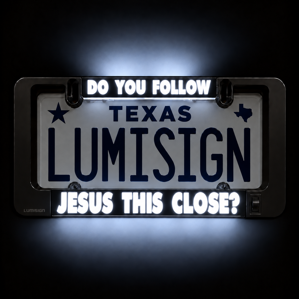 Close-up of illuminated license plate frame reading “TEXAS LUMISIGN”