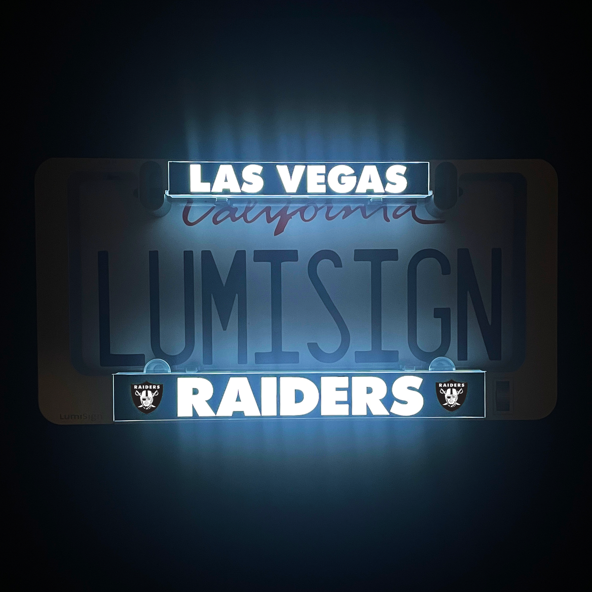 Backlit LumiSign insert reading LAS VEGAS above RAIDERS in blue and white