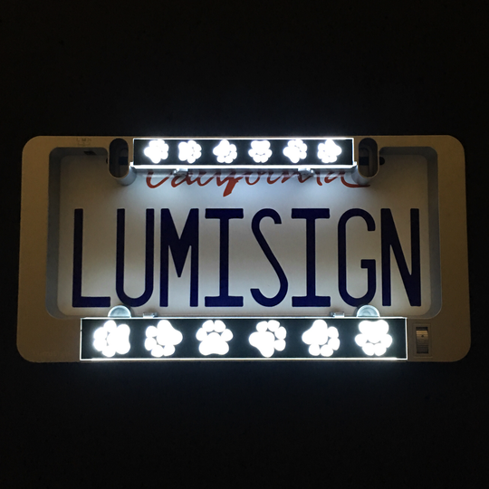 LumiSign paw print light insert bars, glowing paw icons above and below