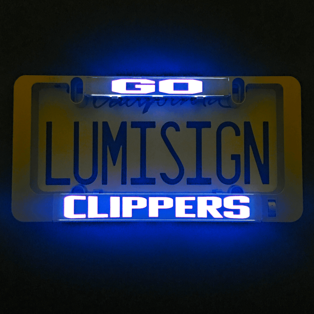 Lit LumiSign CLIPPERS insert panel with blue and white text on a dark backing
