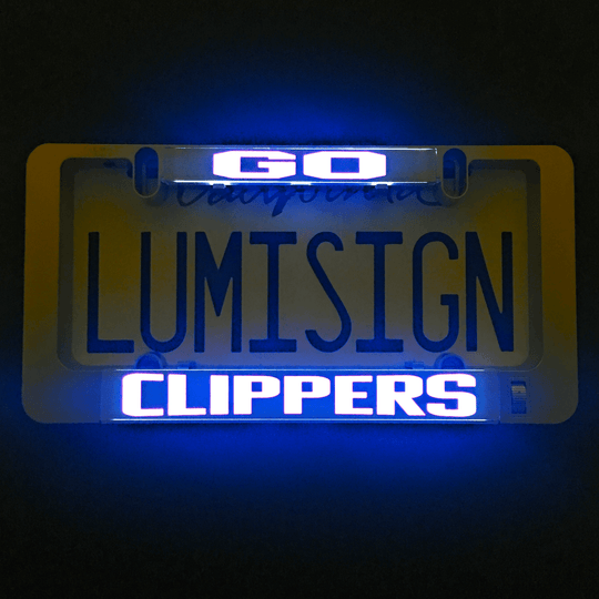Lit LumiSign CLIPPERS insert panel with blue and white text on a dark backing