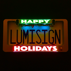 Illuminated insert panel with green HAPPY and red HOLIDAYS lettering