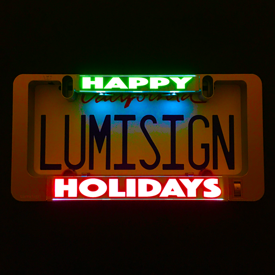 Illuminated insert panel with green HAPPY and red HOLIDAYS lettering