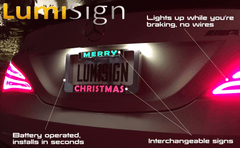 Lumisign rear license plate insert showing MERRY CHRISTMAS message