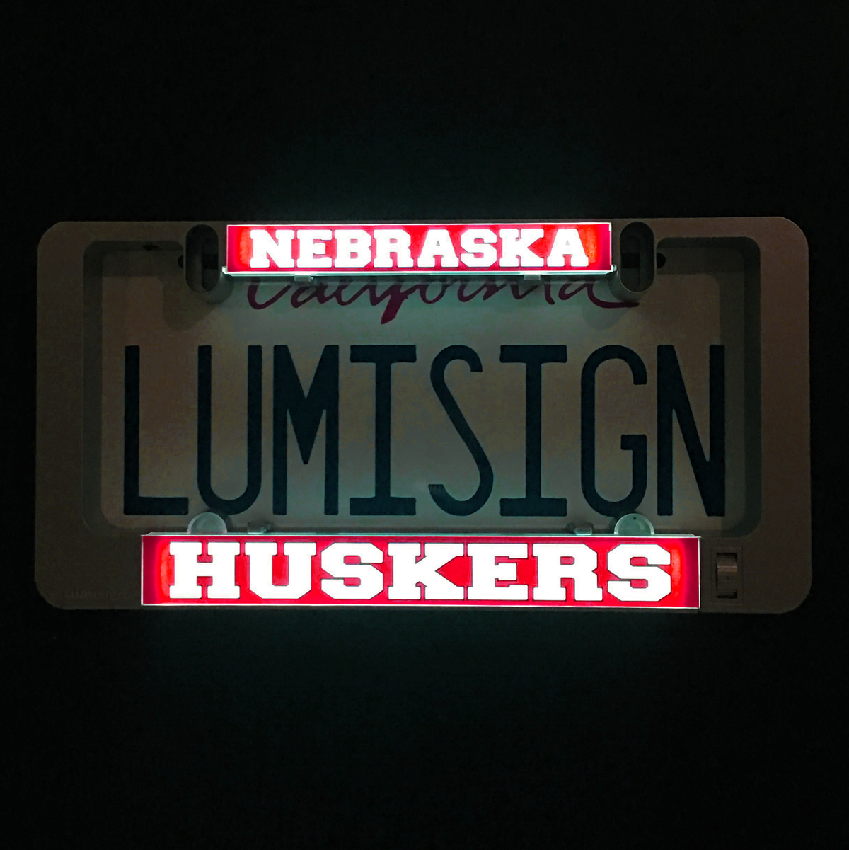 LumiSign insert with glowing red 'NEBRASKA' and 'HUSKERS' team text
