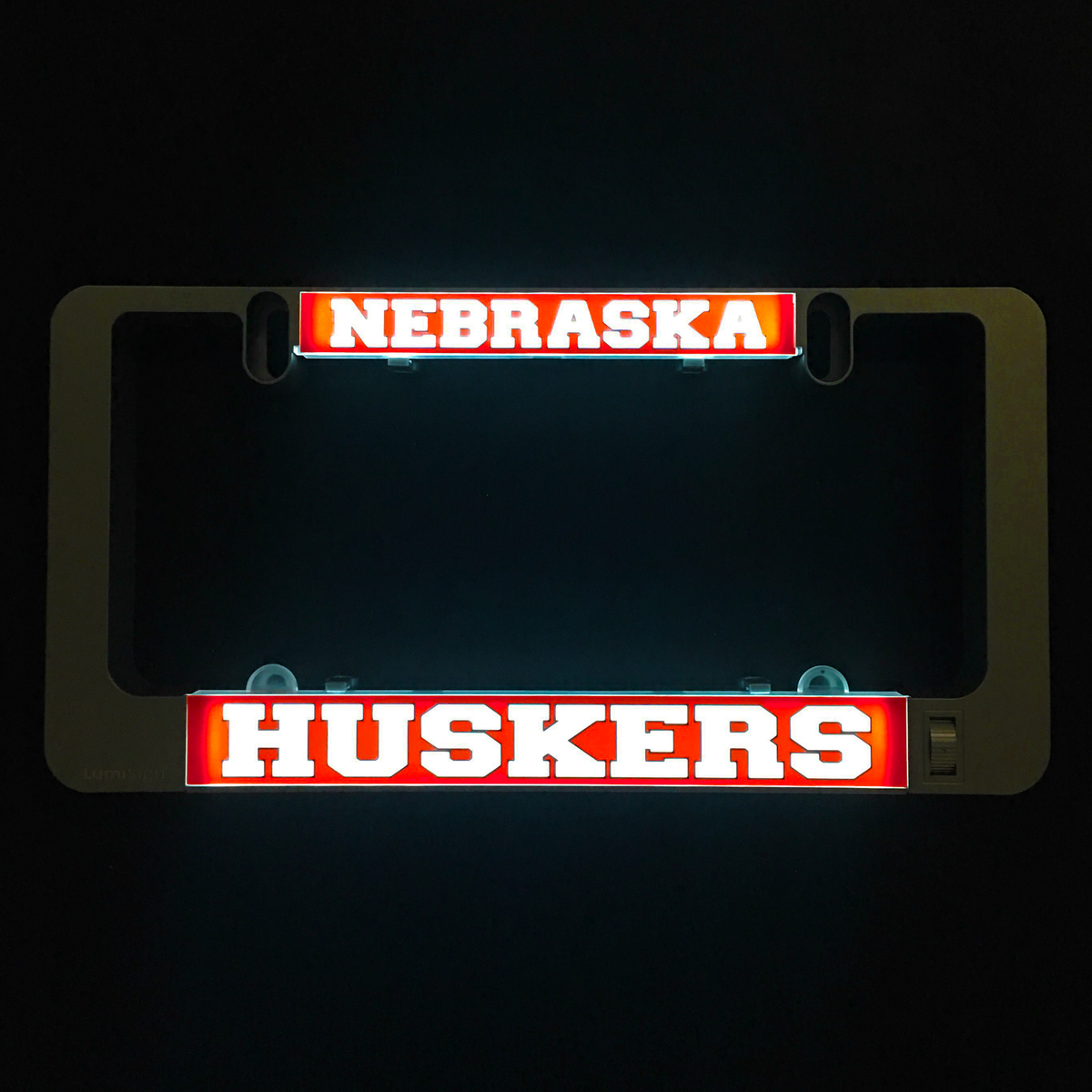 LumiSign insert with glowing red 'NEBRASKA' and 'HUSKERS' team text