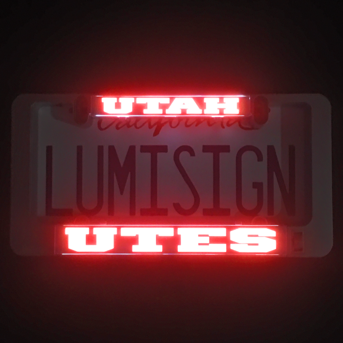 Illuminated UTAH UTES LumiSign inserts with red glowing UTAH and UTES text