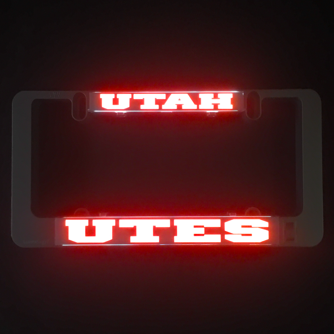 Red glowing UTAH and UTES LumiSign insert lettering on dark background