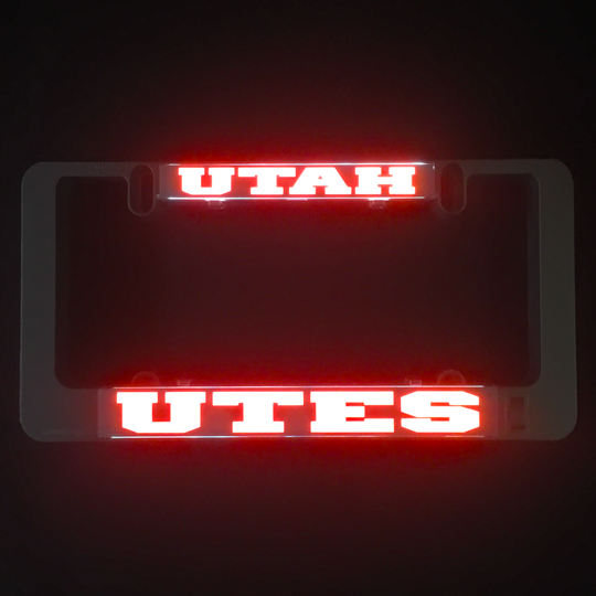 Red glowing UTAH and UTES LumiSign insert lettering on dark background
