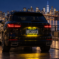 Lumisign light-up license frame with yellow LIT CUSTOM MESSAGE HERE on rear car