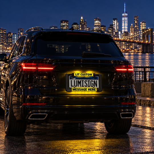 Lumisign light-up license frame with yellow LIT CUSTOM MESSAGE HERE on rear car