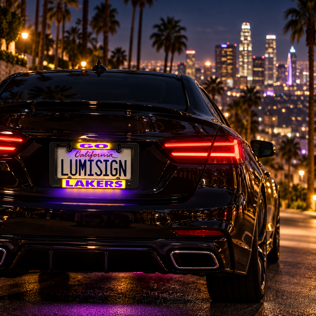 Illuminated LumiSign LAKERS license plate frame mounted on a car rear