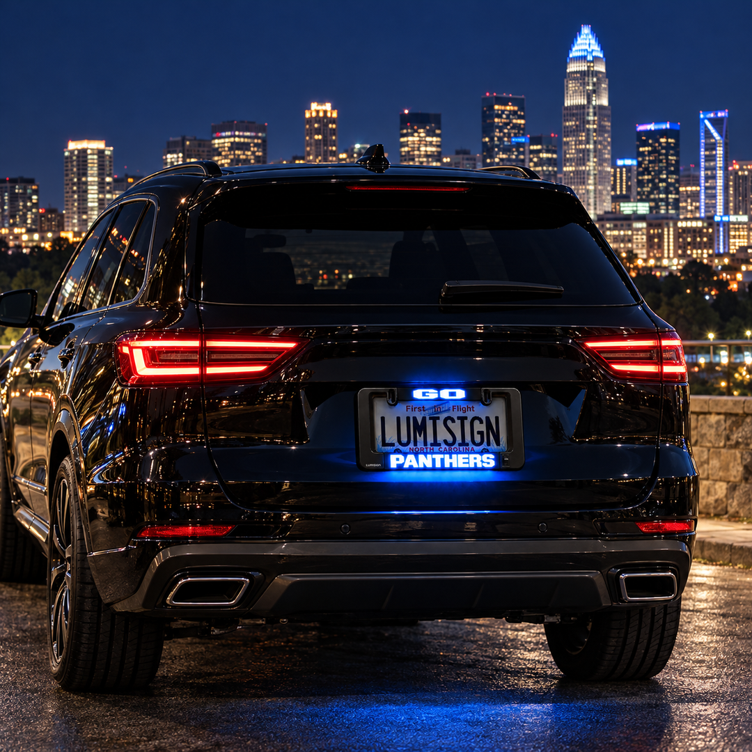 Black car license plate frame with red LED taillights and blue LUMISIGN Panthers display