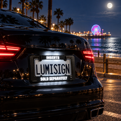 Black car rear license plate frame with LumiSign badge reading “SOLD SEPARATELY”