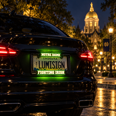 Illuminated Notre Dame Fighting Irish license plate insert in black frame on car