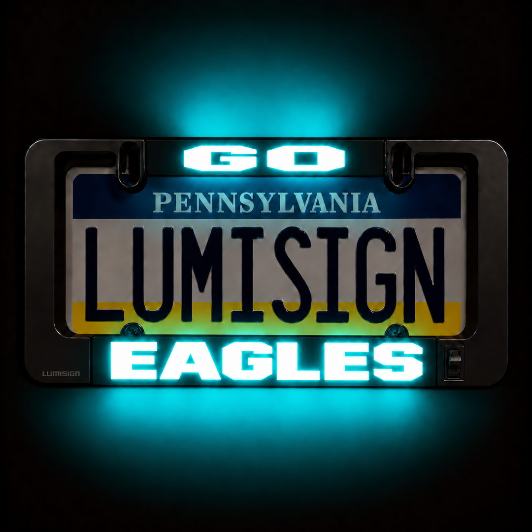 Close-up license plate frame with LUMISIGN Eagles lighted insert