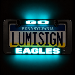 Close-up license plate frame with LUMISIGN Eagles lighted insert