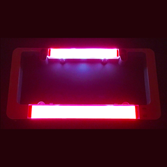 Red illuminated brake light insert bars for LumiSign in a dark housing