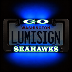 Close-up LED license plate frame with blue glow, showing Washington and Seahawks