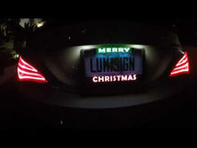 Load and play video in Gallery viewer, LumiSign – The Auto Illuminated License Plate Frame with Switchable Inserts | Lights Up While You Brake | No Wires, Battery Operated | Installs in Seconds (Black Frame)
