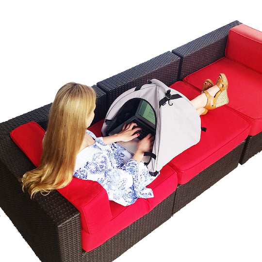 Laptop tent with viewing window over a couch, light gray and black fabric